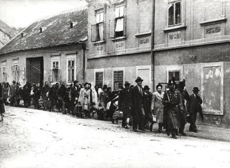 A group of Hungarian Jews being forcibly displaced in Hungary in 1944.
